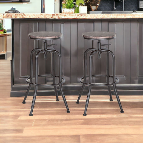 Set of Two Adjustable Height Brown And Black Steel Swivel Backless Counter Height Bar Chairs